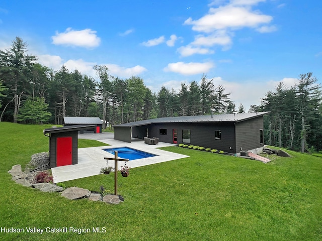 501 Birch St, Copake, NY 12516 - back of house featuring a patio, a lawn, an outdoor pool, and an outdoor structure