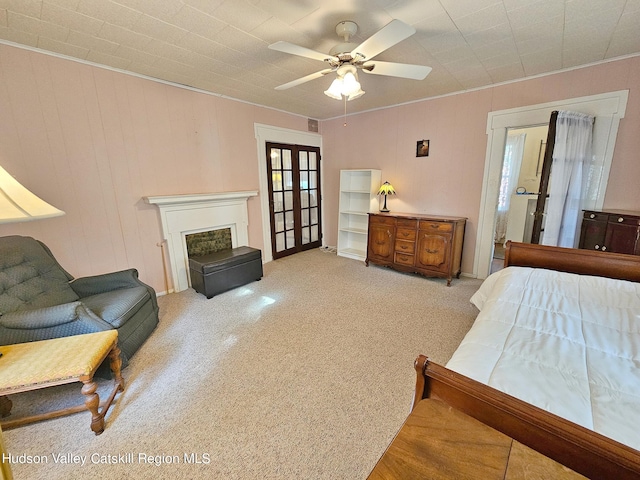 bedroom featuring ceiling fan and french doors