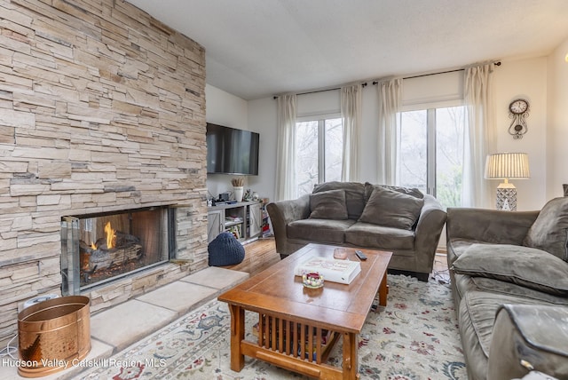 217 Aspen Ter, Poughkeepsie, NY 12601 - living room with a fireplace and wood finished floors