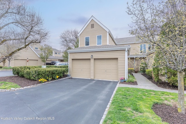 217 Aspen Ter, Poughkeepsie, NY 12601 - multi unit property featuring roof with shingles, driveway, and a garage