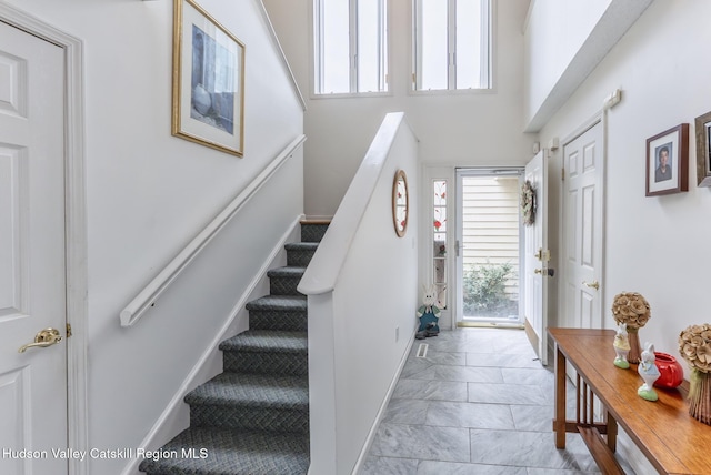 217 Aspen Ter, Poughkeepsie, NY 12601 - entryway with stairs, marble finish floor, and baseboards