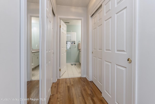 217 Aspen Ter, Poughkeepsie, NY 12601 - hallway featuring baseboards and wood finished floors