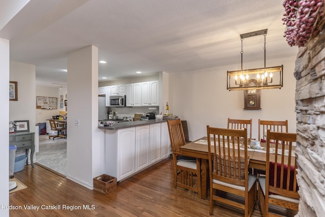 217 Aspen Ter, Poughkeepsie, NY 12601 - dining space featuring recessed lighting, a notable chandelier, and wood finished floors