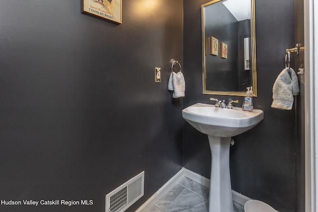 217 Aspen Ter, Poughkeepsie, NY 12601 - bathroom featuring marble finish floor, visible vents, and baseboards