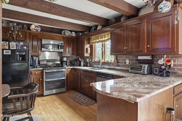 2727 County Route 8, Elizaville, NY 12523 - kitchen with stainless steel appliances, a sink, beamed ceiling, decorative backsplash, and light wood-type flooring