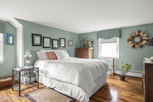 2727 County Route 8, Elizaville, NY 12523 - bedroom featuring wood finished floors, baseboard heating, and a baseboard radiator