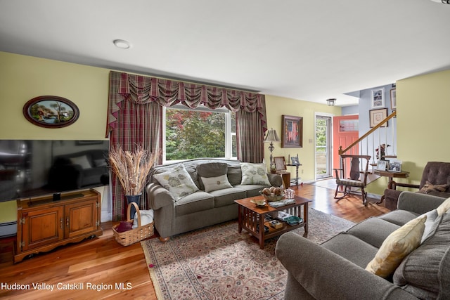 2727 County Route 8, Elizaville, NY 12523 - living room featuring light wood-type flooring, stairs, and a baseboard heating unit