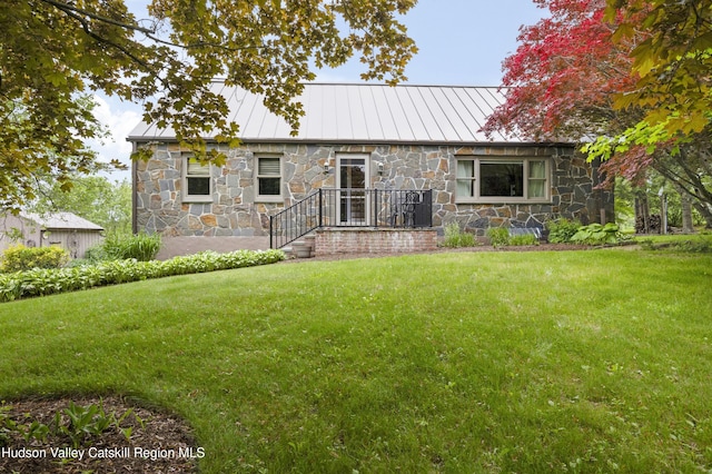 2727 County Route 8, Elizaville, NY 12523 - view of front of home with a standing seam roof, stone siding, a front lawn, and metal roof
