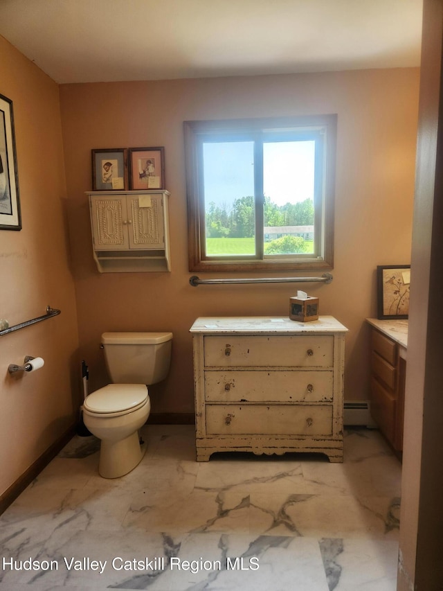 2773 Lucas Tpke, Accord, NY 12404 - bathroom with vanity, toilet, a baseboard radiator, and baseboards