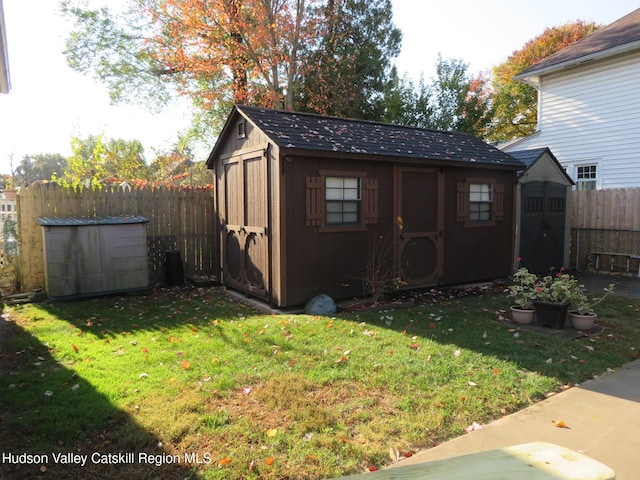 view of outbuilding featuring a yard