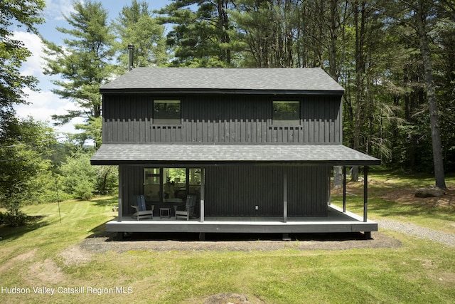 rear view of house with a lawn