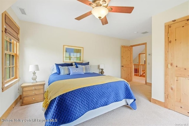 carpeted bedroom featuring ceiling fan