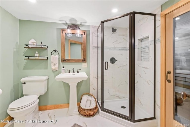 bathroom with toilet and an enclosed shower