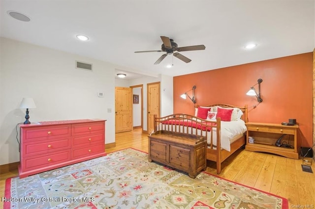 bedroom featuring ceiling fan and light hardwood / wood-style floors