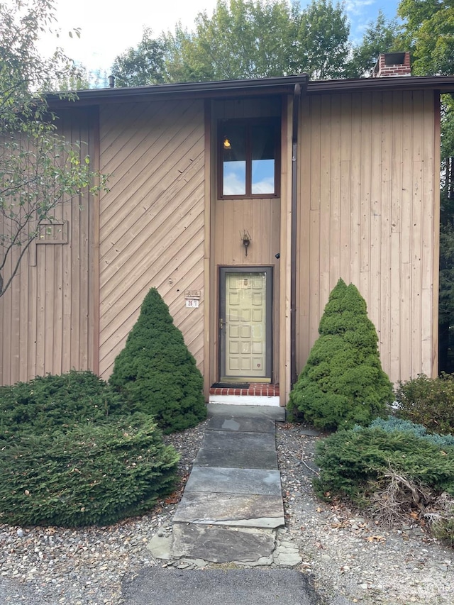 26 Townhouse Ln Unit 4A, Windham, NY 12496 - property entrance with a chimney