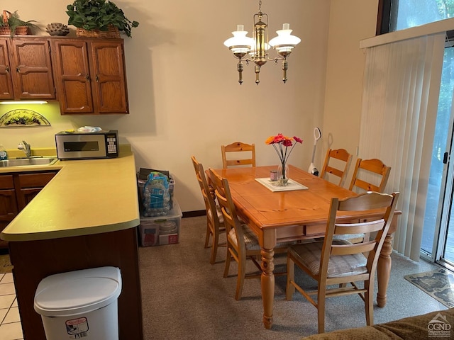 26 Townhouse Ln Unit 4A, Windham, NY 12496 - carpeted dining area with a sink and a chandelier