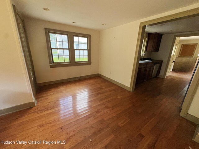 4098 US Highway 209, Stone Ridge, NY 12484 - unfurnished room with wood finished floors, baseboards, and a sink