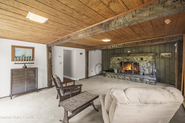 2410 Bruynswick Rd, Wallkill, NY 12589 - living room featuring wooden ceiling, light carpet, a stone fireplace, and baseboards