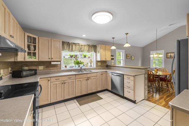 2410 Bruynswick Rd, Wallkill, NY 12589 - kitchen with stainless steel appliances, under cabinet range hood, light brown cabinetry, a peninsula, and a sink