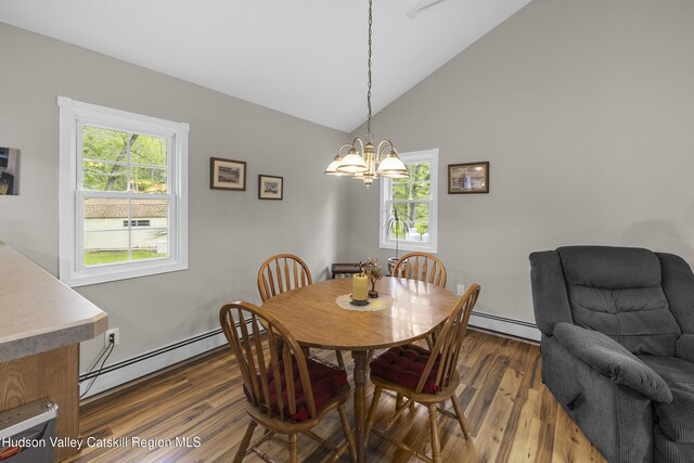 2410 Bruynswick Rd, Wallkill, NY 12589 - dining space featuring baseboard heating, a chandelier, healthy amount of natural light, and high vaulted ceiling