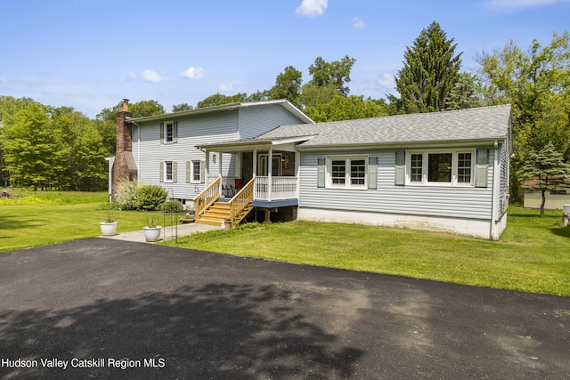 2410 Bruynswick Rd, Wallkill, NY 12589 - view of front facade featuring a porch, a front lawn, a chimney, and roof with shingles