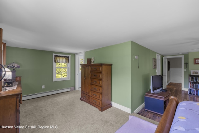 2410 Bruynswick Rd, Wallkill, NY 12589 - living area with a baseboard radiator, baseboards, and carpet
