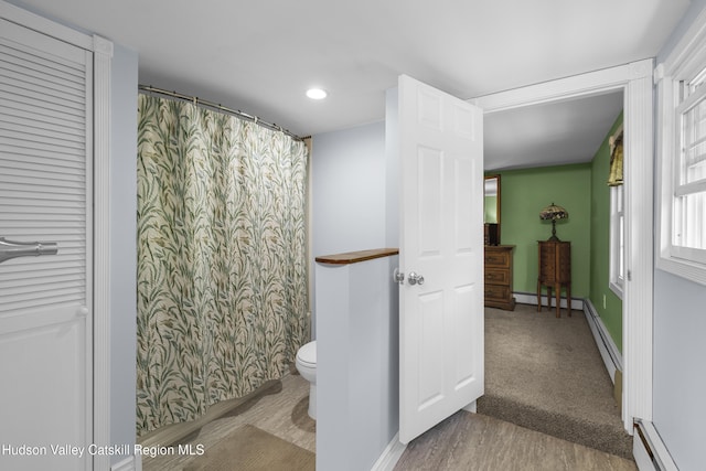 2410 Bruynswick Rd, Wallkill, NY 12589 - full bathroom with a baseboard radiator, toilet, wood finished floors, recessed lighting, and baseboards