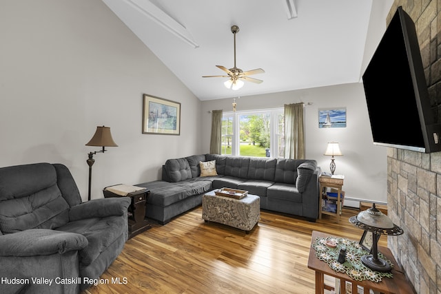 2410 Bruynswick Rd, Wallkill, NY 12589 - living area featuring wood finished floors, ceiling fan, high vaulted ceiling, and a baseboard radiator