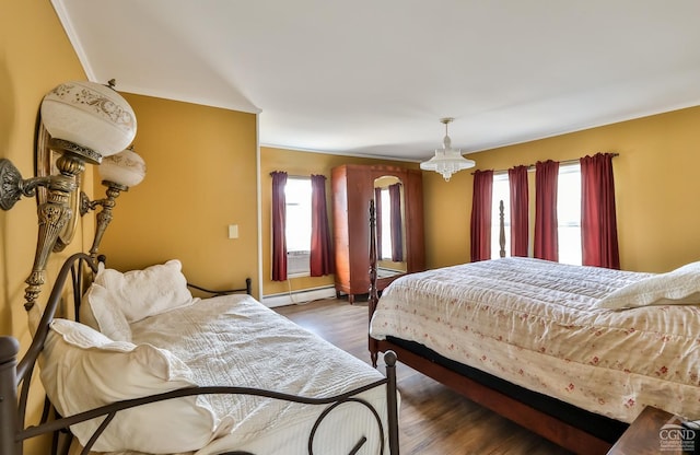 51 Division St, Hunter, NY 12442 - bedroom with baseboard heating, multiple windows, and dark wood-style floors