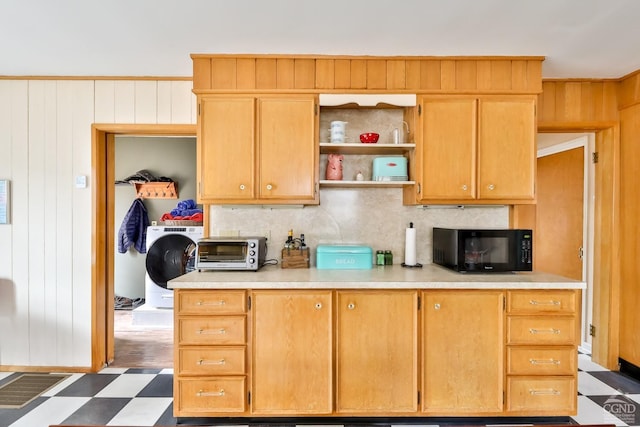 51 Division St, Hunter, NY 12442 - kitchen with black microwave, washer / dryer, open shelves, light countertops, and wood walls