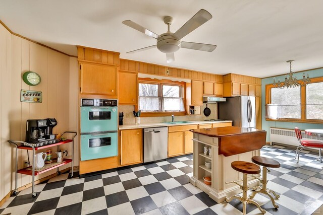 51 Division St, Hunter, NY 12442 - kitchen with appliances with stainless steel finishes, light flooring, light countertops, a ceiling fan, and a sink