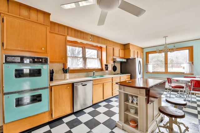 51 Division St, Hunter, NY 12442 - kitchen with stainless steel appliances, tile patterned floors, a sink, and healthy amount of natural light