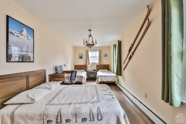 51 Division St, Hunter, NY 12442 - bedroom featuring dark wood finished floors, a baseboard radiator, and a chandelier