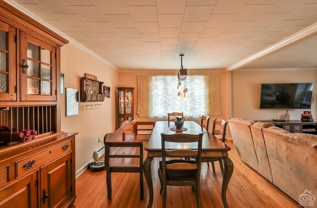 51 Division St, Hunter, NY 12442 - dining space with ornamental molding, baseboards, and light wood-type flooring