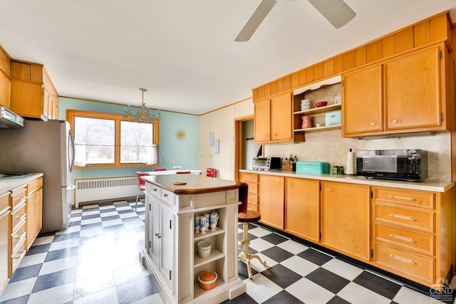 51 Division St, Hunter, NY 12442 - kitchen featuring open shelves, tile patterned floors, black microwave, radiator, and ceiling fan