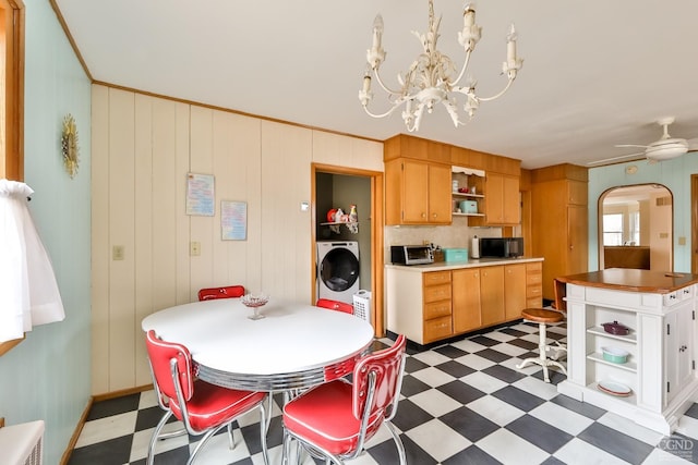 51 Division St, Hunter, NY 12442 - dining space with tile patterned floors, washer / dryer, a chandelier, and ceiling fan