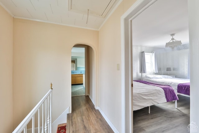 51 Division St, Hunter, NY 12442 - hall with wood finished floors, attic access, arched walkways, and crown molding