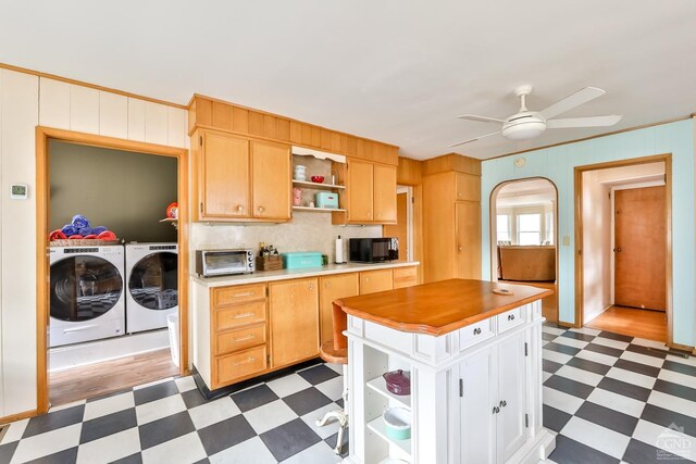 51 Division St, Hunter, NY 12442 - kitchen with dark flooring, independent washer and dryer, open shelves, black microwave, and ceiling fan