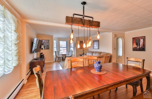51 Division St, Hunter, NY 12442 - dining space featuring a baseboard heating unit, crown molding, and light wood-style flooring