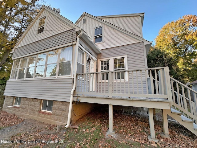 rear view of house with a sunroom