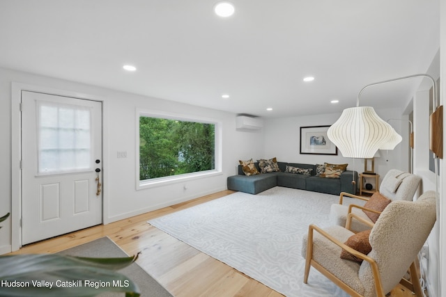 200 Wilbur Ave, Kingston, NY 12401 - living room with a wall mounted AC, wood finished floors, recessed lighting, and baseboards