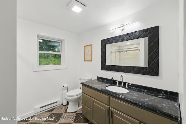 200 Wilbur Ave, Kingston, NY 12401 - full bathroom with a baseboard heating unit, vanity, toilet, a shower with curtain, and tile patterned floors
