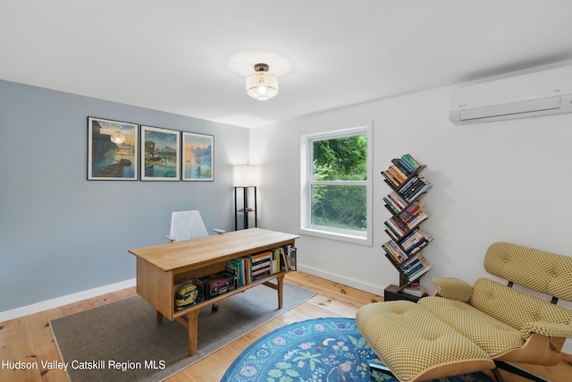200 Wilbur Ave, Kingston, NY 12401 - office with a wall mounted air conditioner, light wood finished floors, and baseboards
