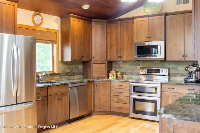 526 Taghkanic Rd, Elizaville, NY 12523 - kitchen featuring appliances with stainless steel finishes, wooden ceiling, a sink, light wood-type flooring, and lofted ceiling