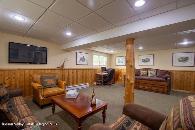 526 Taghkanic Rd, Elizaville, NY 12523 - living room with a drop ceiling, a baseboard heating unit, a wainscoted wall, wooden walls, and carpet flooring