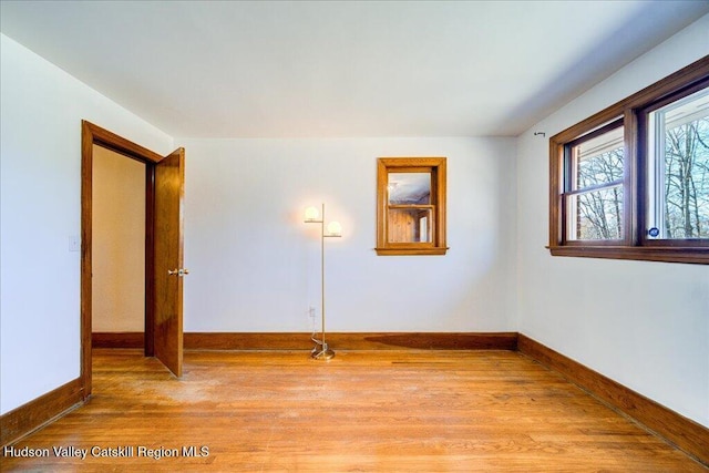 spare room featuring light hardwood / wood-style floors