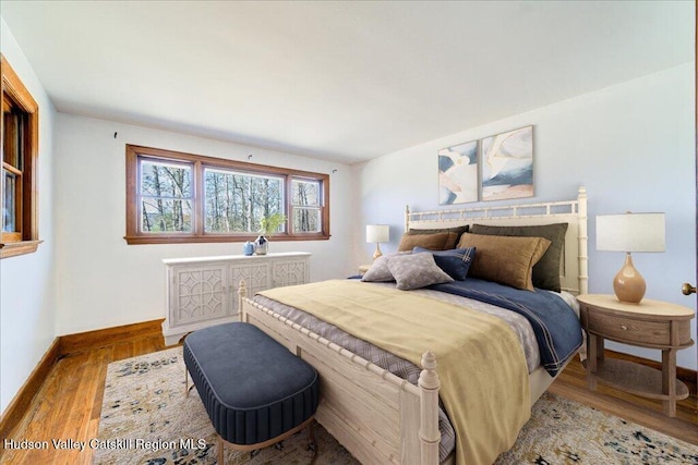 bedroom with light hardwood / wood-style flooring