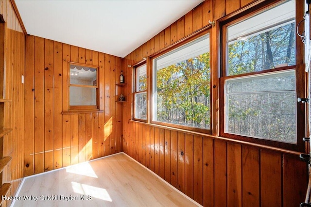 unfurnished sunroom with a wealth of natural light