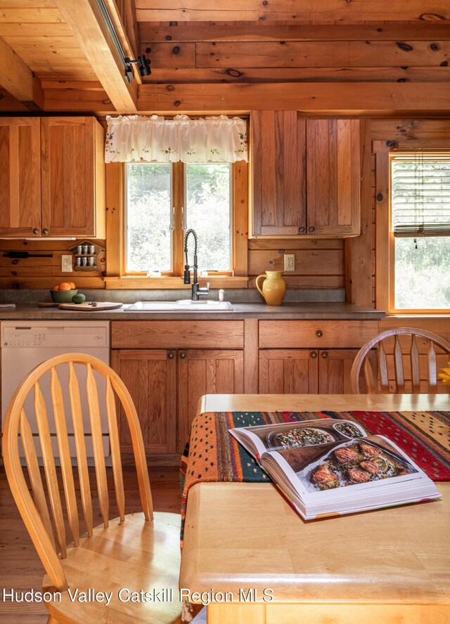 422 Waterview Dr, Andes, NY 13731 - kitchen with a sink, dishwasher, light wood-style flooring, wooden ceiling with exposed beams, and brown cabinets