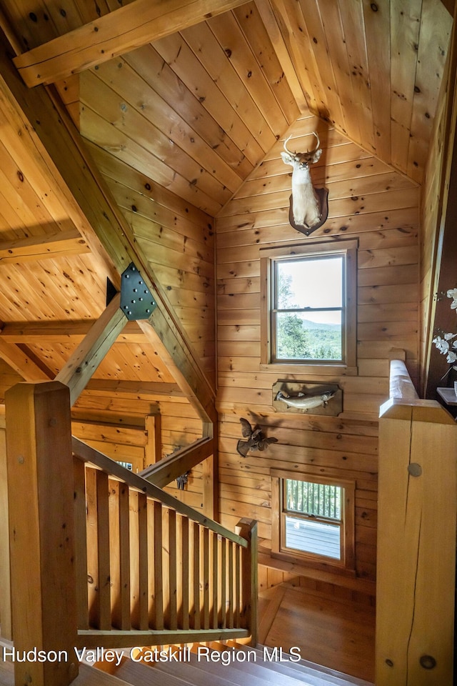422 Waterview Dr, Andes, NY 13731 - staircase featuring wooden ceiling, lofted ceiling, healthy amount of natural light, and wooden walls